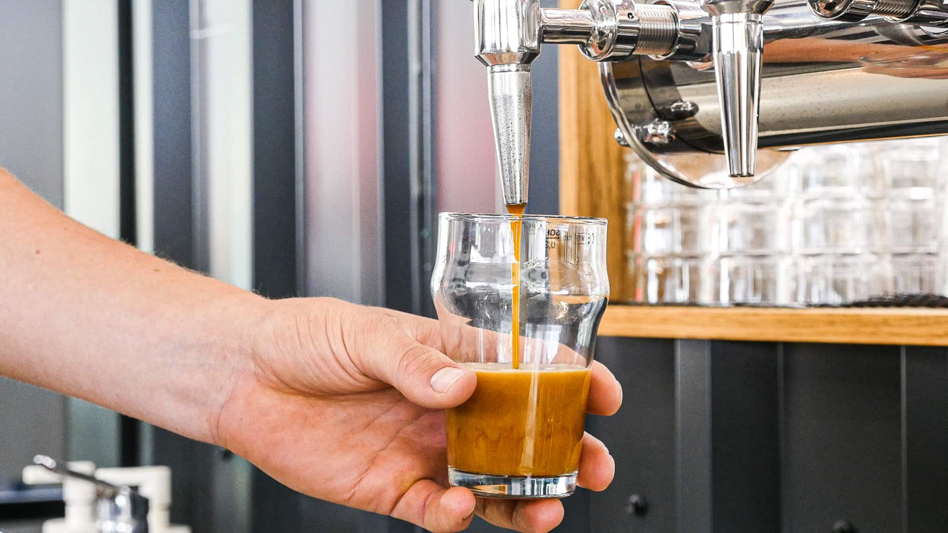 Coffee being poured from tap